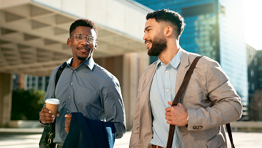 smile-talking-walking-with-business-men-city-their-morning-commute-into-work-together-collaboration-planning-ideas-with-employee-partners-chatting-outdoor-urban-town 1